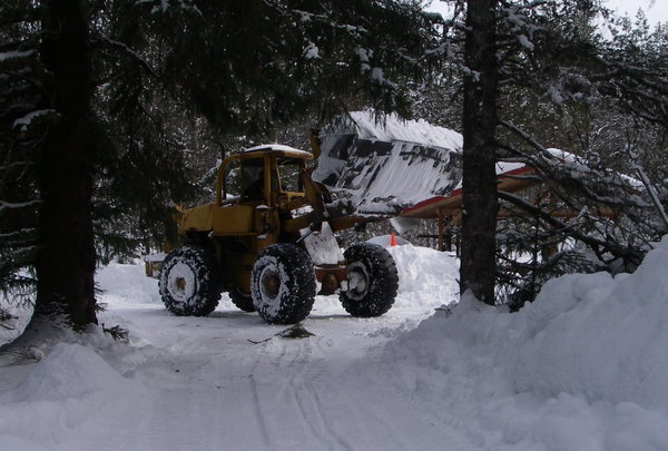 A 'loader' is the best way to move snow...