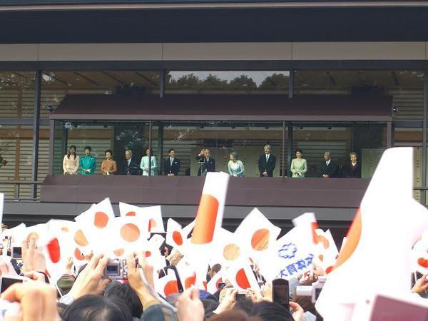 Emperor Akihito greets the masses at the Imperial Palace