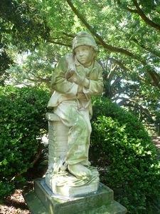 Statue of Sweeping Boy in the Royal Botanic Gardens