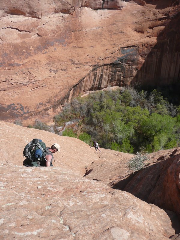 Brande coming up the rock face at Coyote Gulch