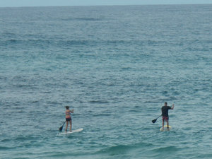 Paddle Boarders in the Pacific Ocean