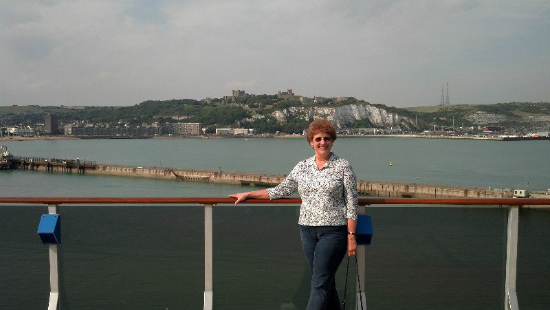 Carol on the ship - white cliffs behind.