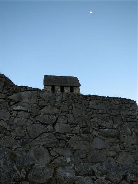 The guard house with the moon in the background.