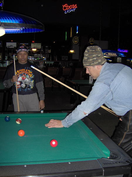 Side Pockets playing pool