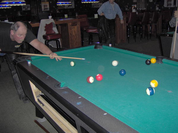 Side Pockets playing pool