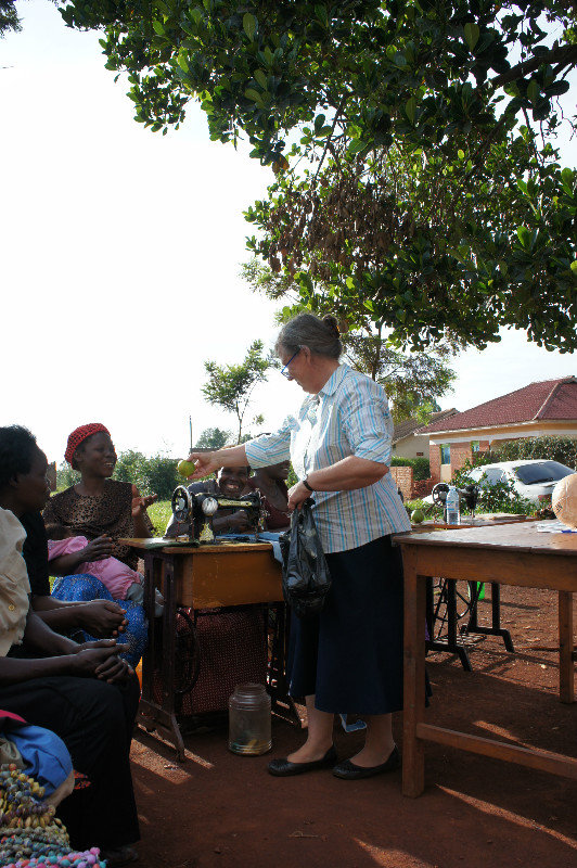 Susan giving out fruit to the pupils