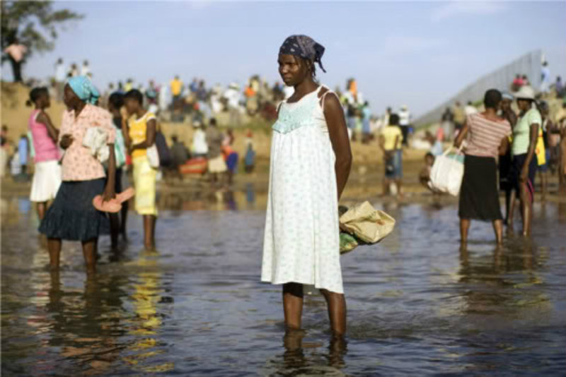 Women standing in the Massacre River between Haiti and the Dominican Republic