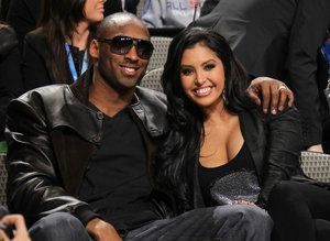 Vanessa Bryant smiles in a black top with Kobe Bryant