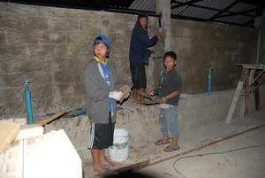children stuccoing the walls