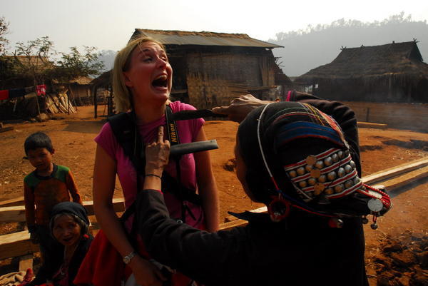 village woman threatening one of the trekkers