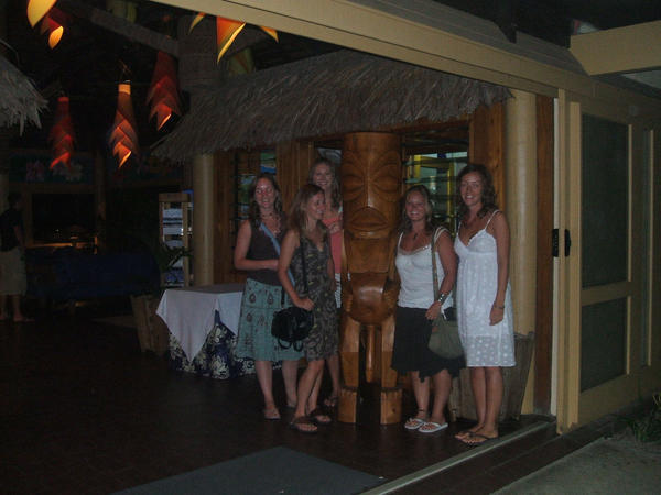 Next to a traditional carving on island night