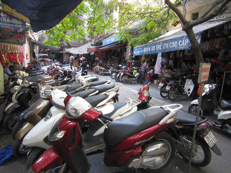 The masses of motorbikes parked in the markets