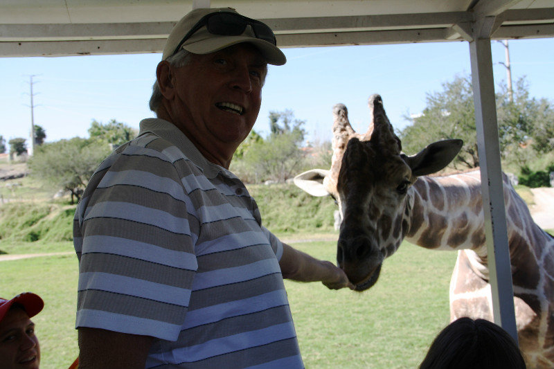 Rick feeding the giraffe on safari