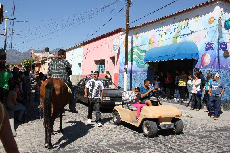 Typical Ajijic traffic, car, golf cart and horse