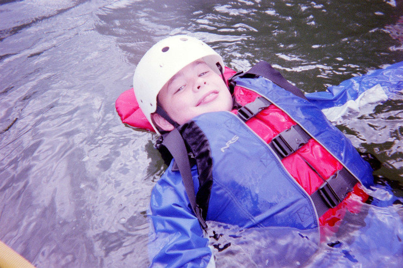 Christian holding on to the raft