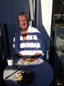Breakfast in his dressing gown