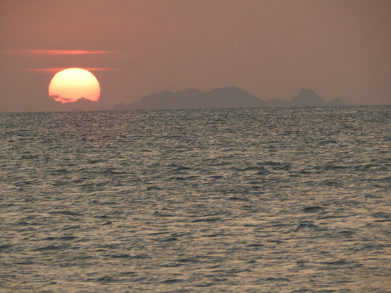 Sun setting over Surat Thani Mainland Thailand