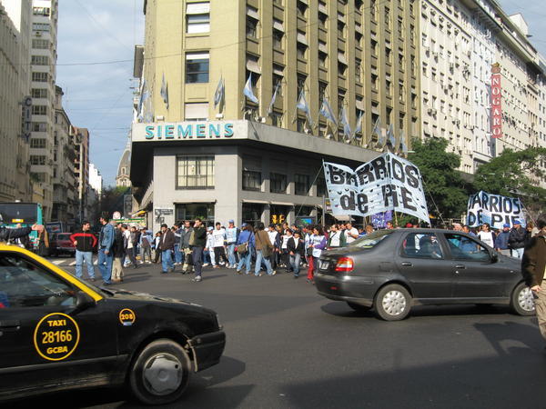 Protesters marching on the Plaza de Mayo