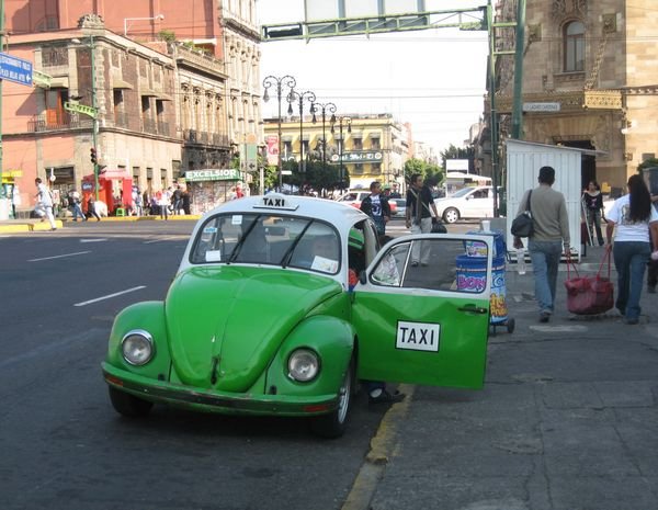 The ubiquitous green and white VW Beetle taxis in Mexico City.