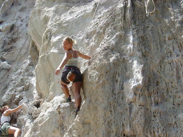 Katja climbs the rock