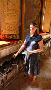 Trying to store up karma by giving alms to the monks