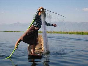 Real fishermen on Inle Lake exhibits the foot rowing prowress