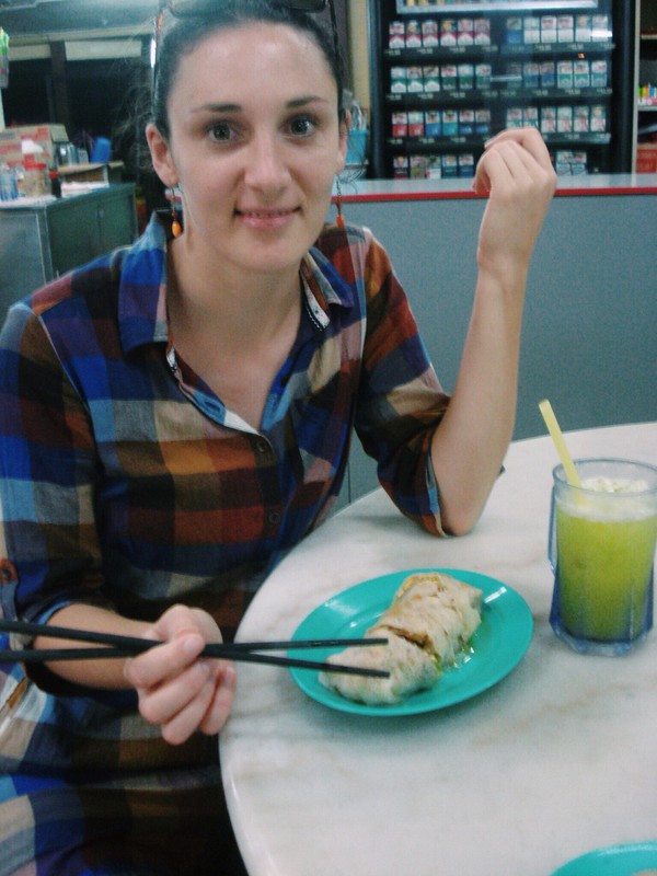 Liz about to get stuck into a Chinese coffee shop dinner of Popiah and Sour Plum and Lime juice - delicious! 