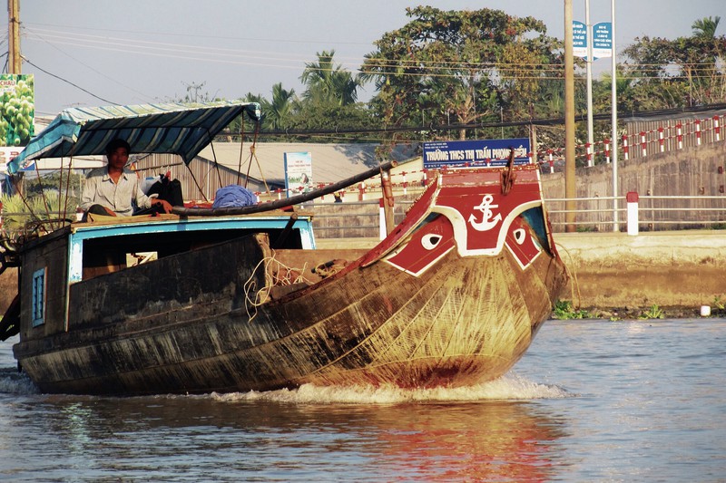 Mekong boat with dragon eyes to scare off the sea monsters and guide sailors home