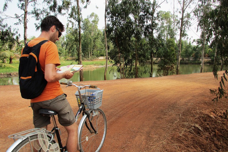 Cycling around the countryside by Tra Vinh - he claims to know where we are...