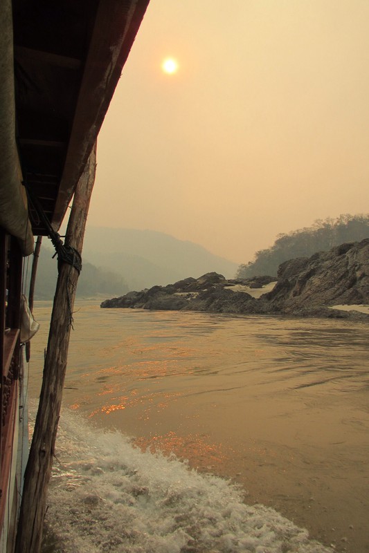 Travelling up the Mekong towards Thailand on a long boat