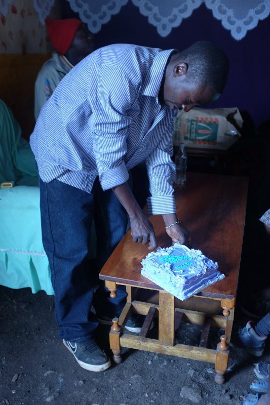 Isaac cutting the cake
