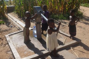 Local kids fetching water