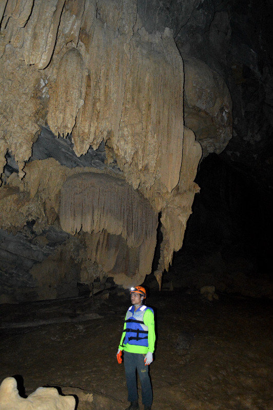 Our Guide Underneath Large Stalactite(s)