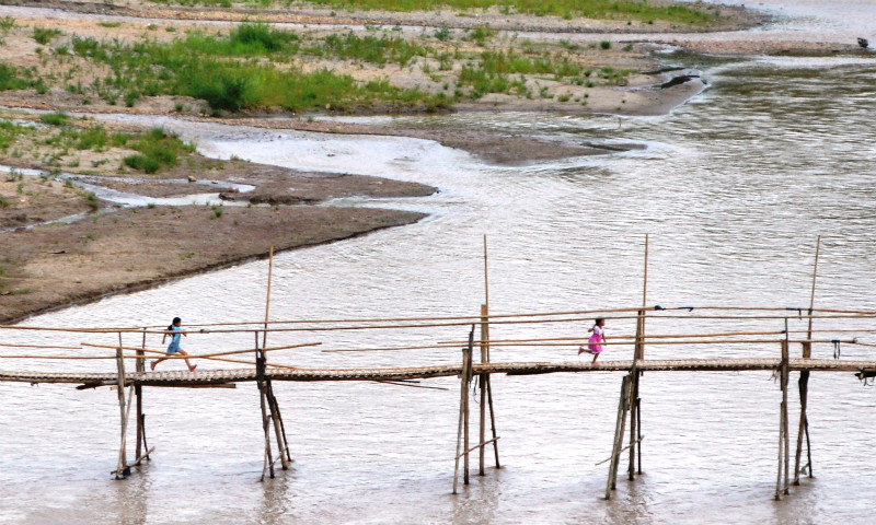 Children playing on the bamboo bridge