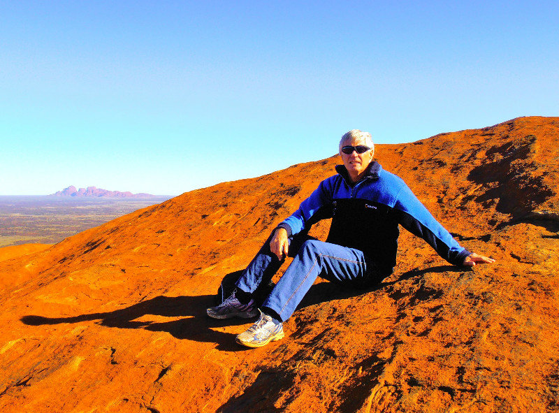 Graeme on top of the rock and Olgas behind