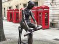 Phone booths and statue