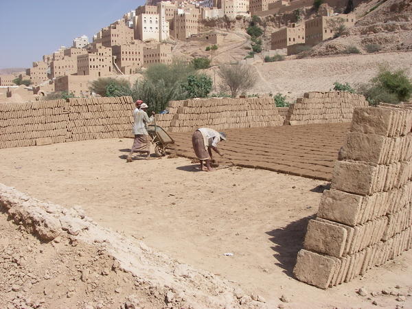Men making mud bricks