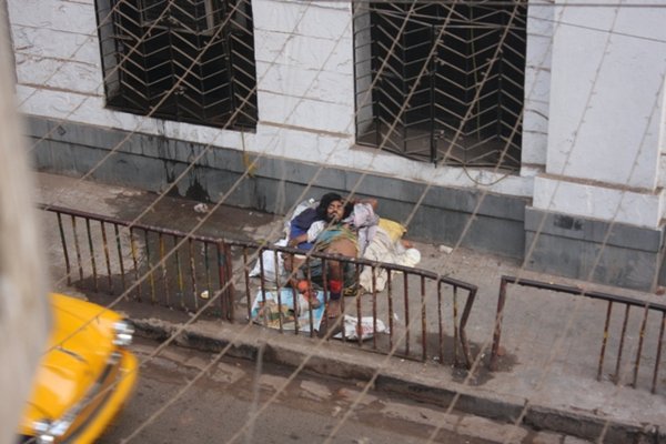 Homeless man sleeping in the street