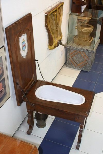 Toilet hidden inside a table