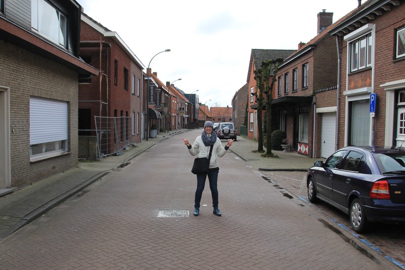 Emma standing with one foot in Netherlands and one foot in Belgium