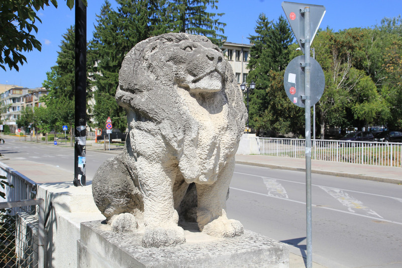 Stone lion adorning a bridge