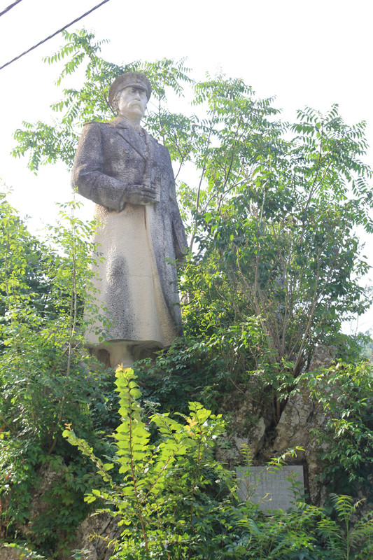 Overgrown statue