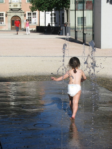 girl playing in the water