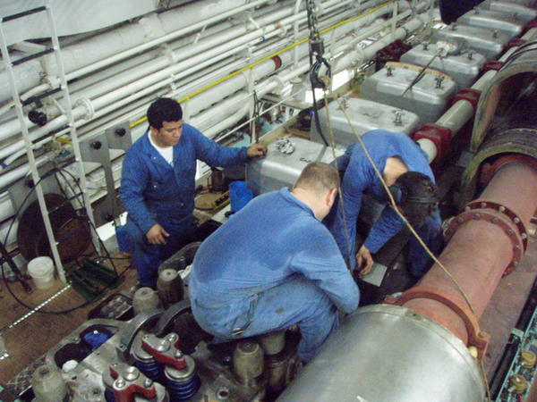 One of the Ship's Engines Being Worked On