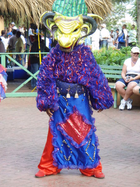 Performer Welcoming the Bus Loads of Tourists