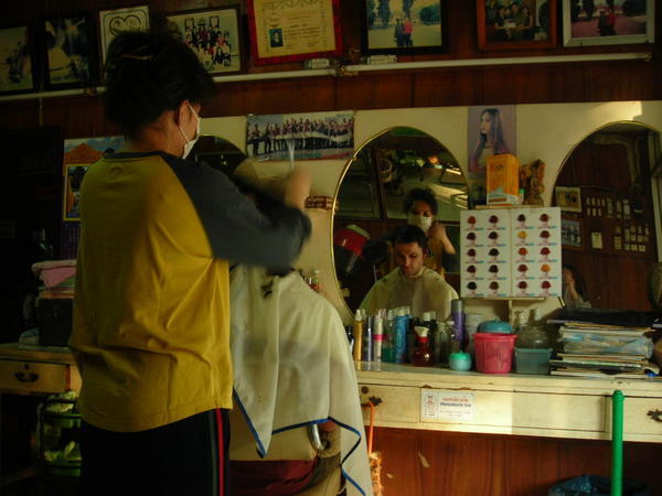 Xavier having a haircut in Vientiane