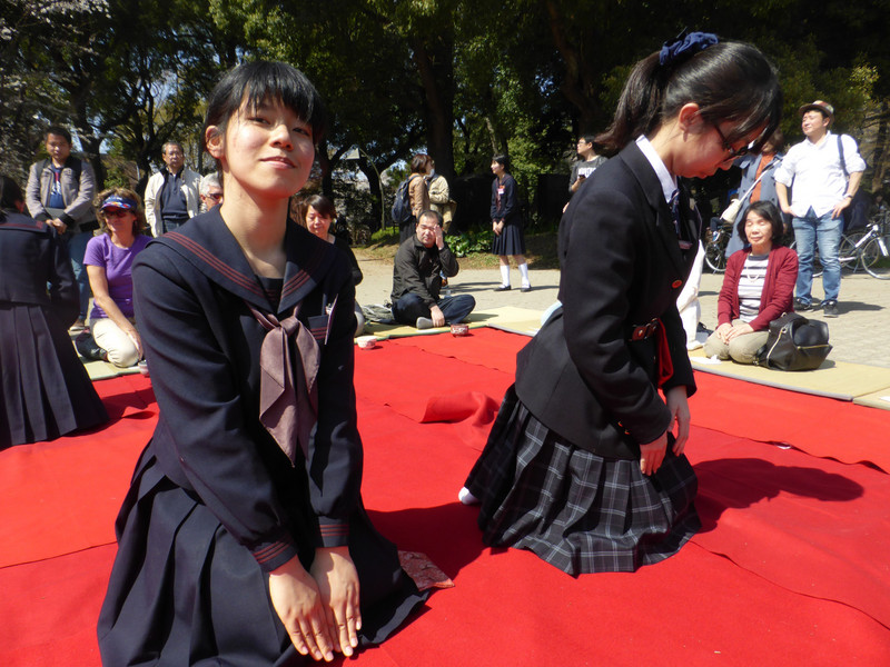 School girls performing the tea ceremony for visitors to the park