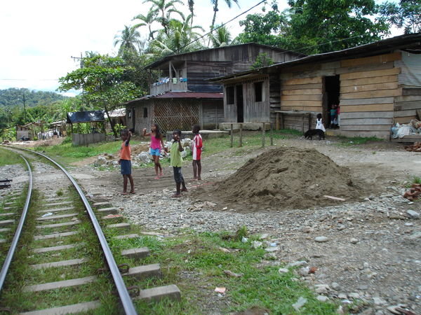 Kids play near the train tracks