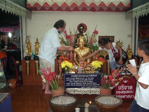 gold leaf covered statue of respected monk