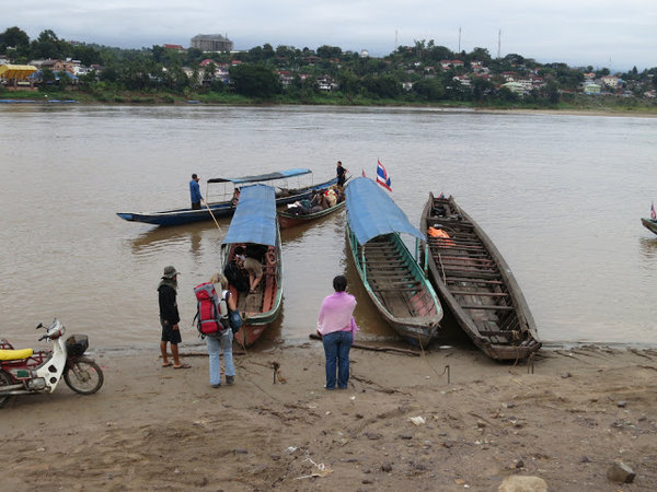 Crossing Mekong River to start river trip